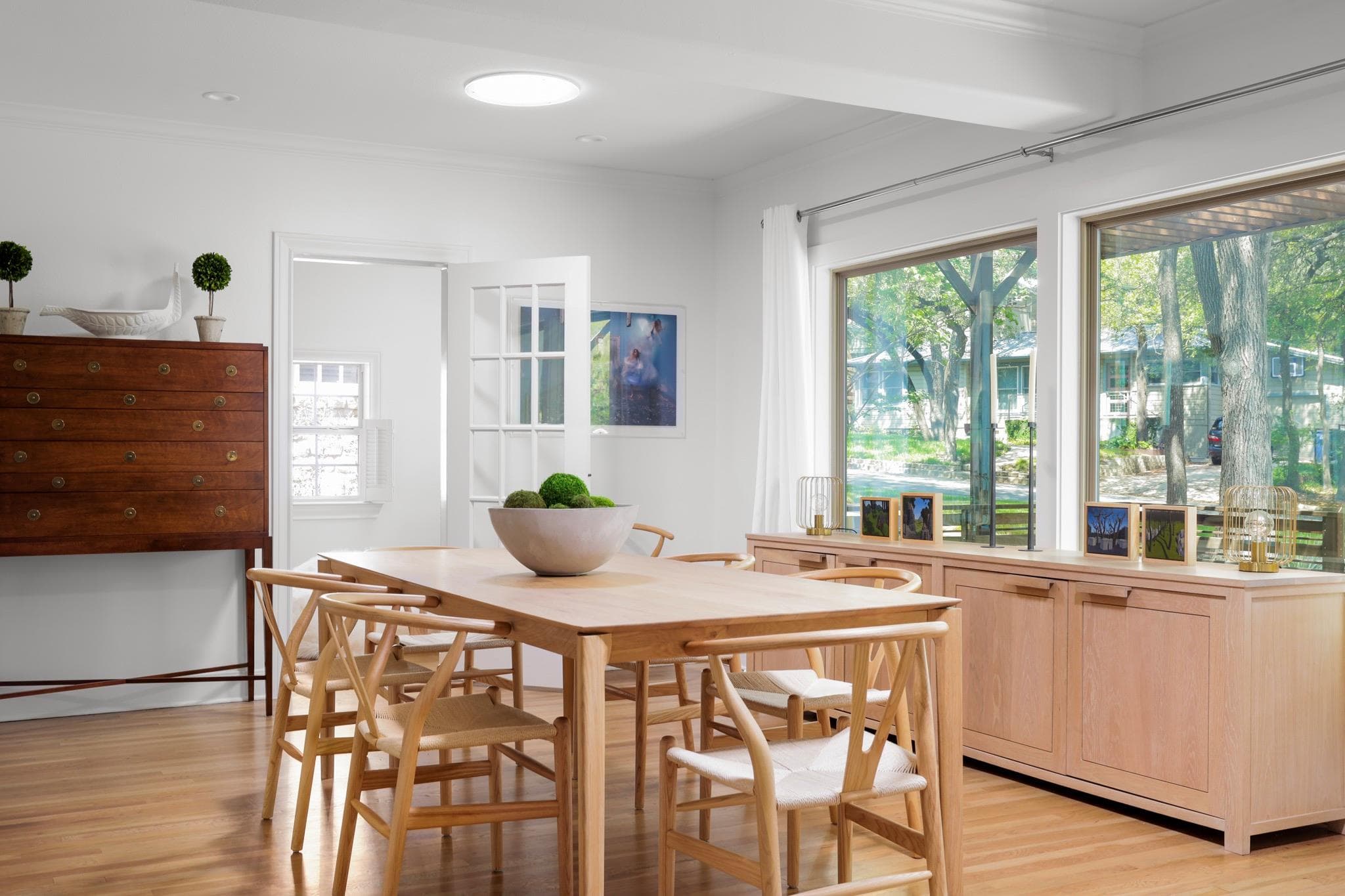 Dining room with crown molding, light wood-type f