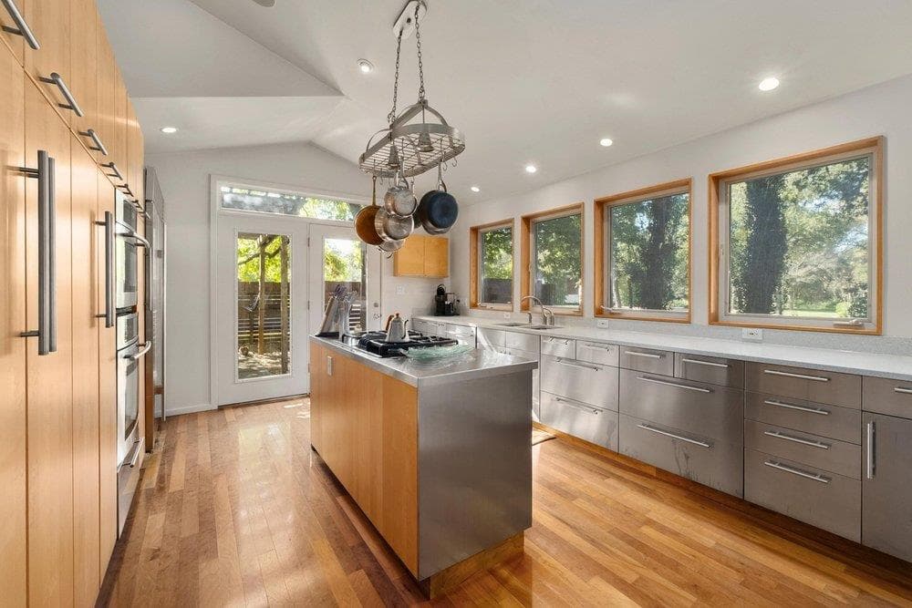 Kitchen featuring modern cabinets, stainless stee