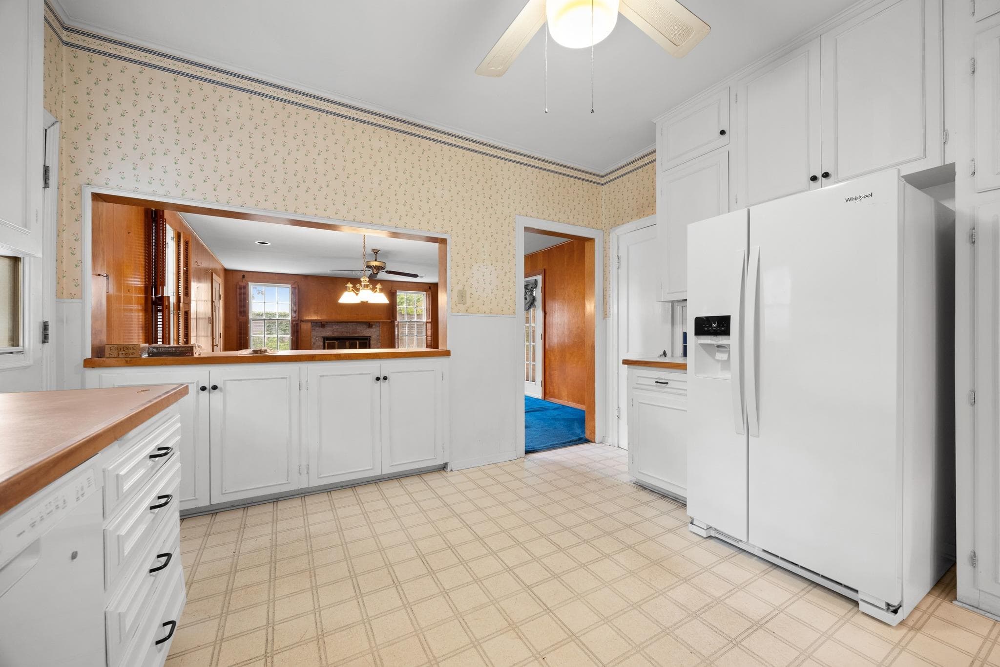 A classic kitchen with white cabinetry and a conv