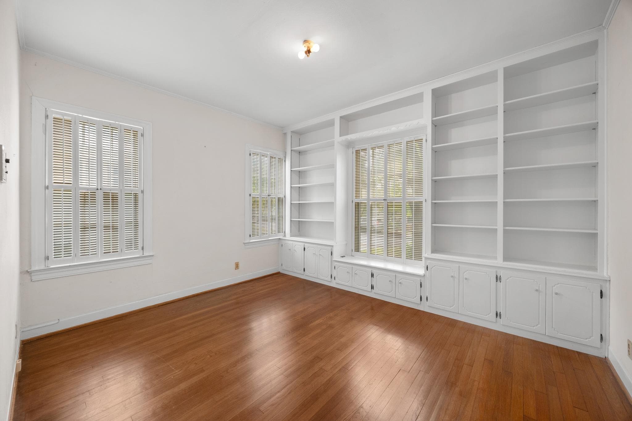 Built-in shelving and cabinetry offer ample stora