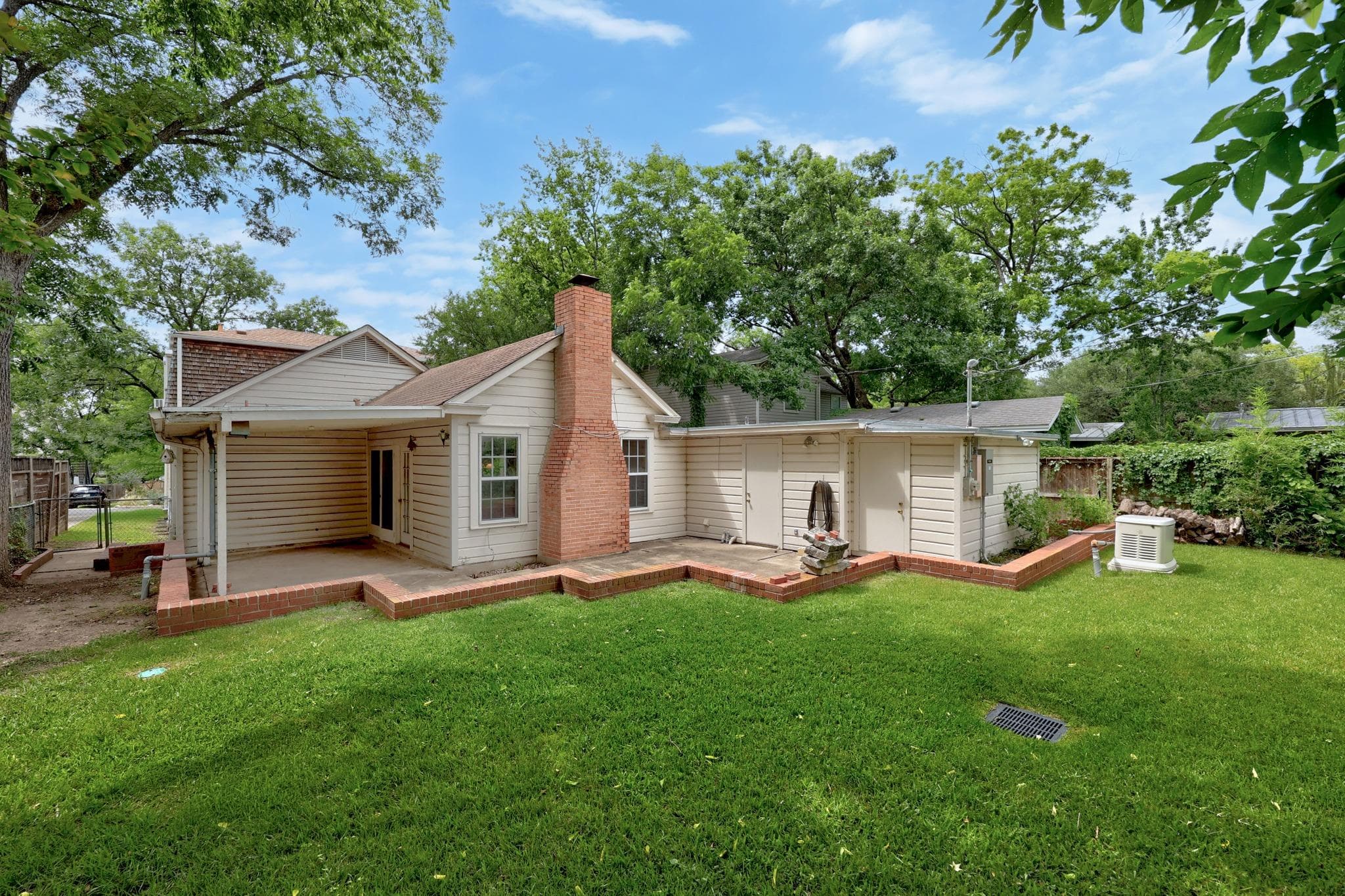 A verdant lawn frames the exterior, highlighting