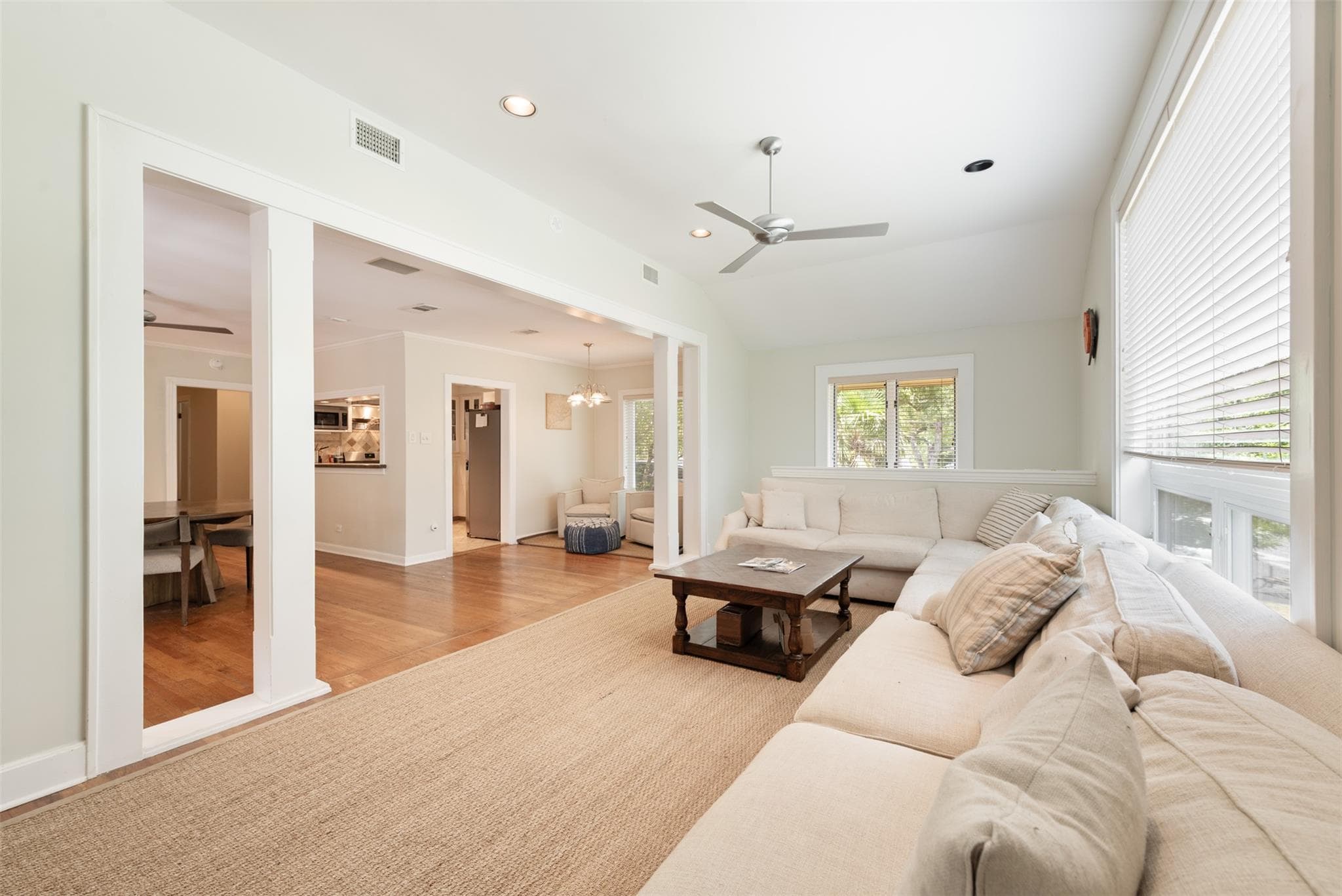 An open concept floorplan features high ceilings