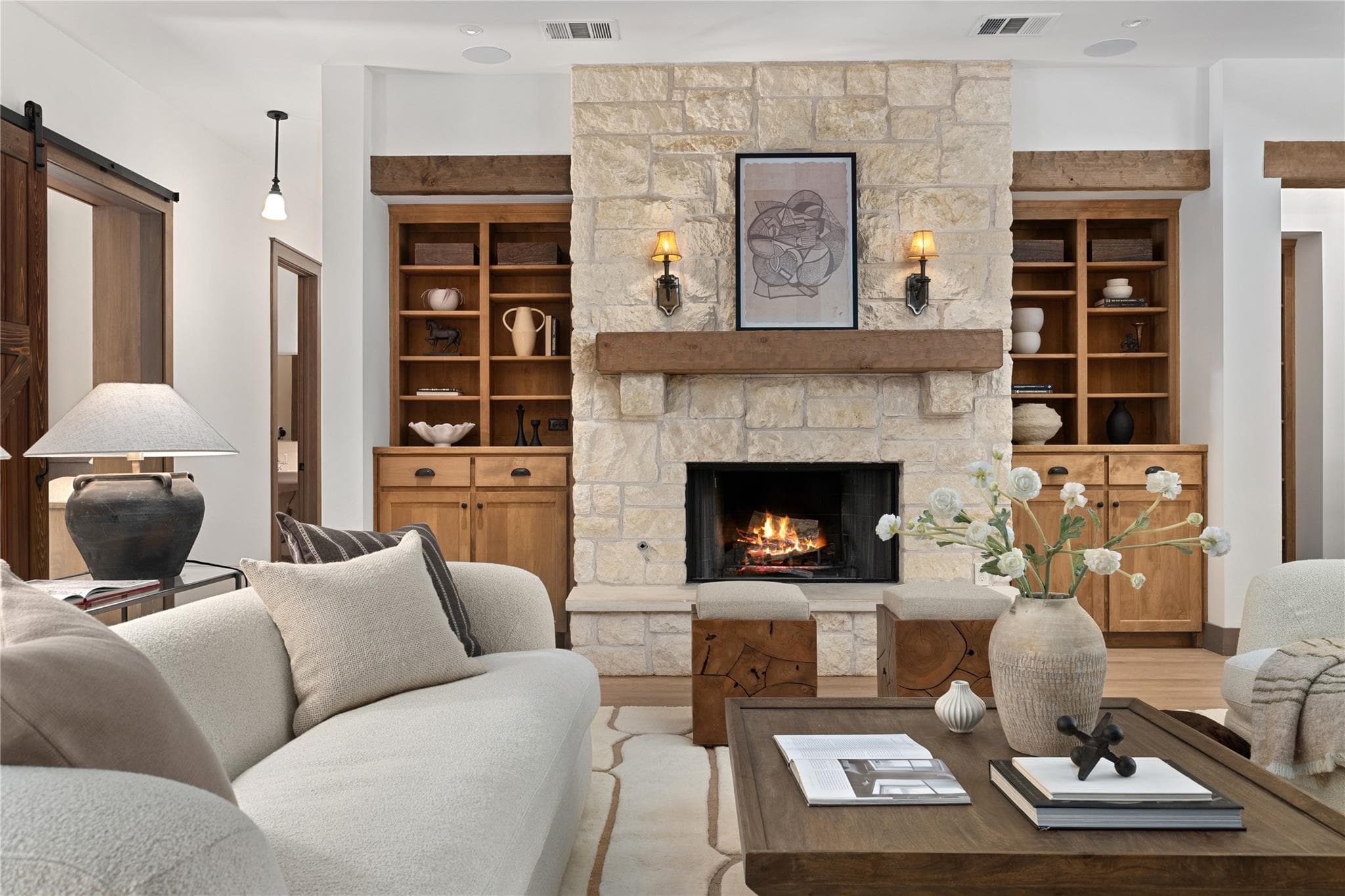 A grand stone fireplace anchors this inviting liv