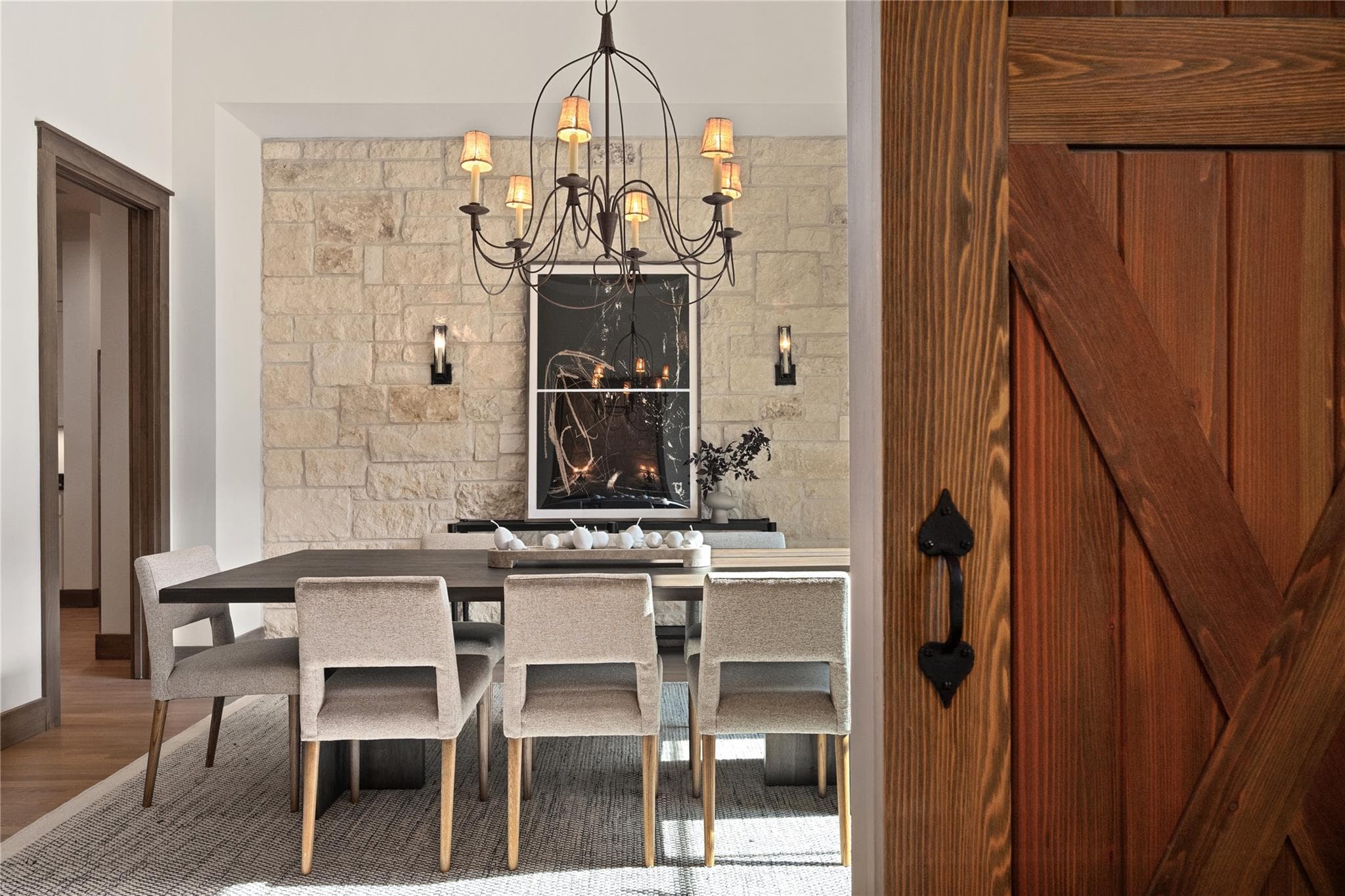 A refined dining space is illuminated by a classi