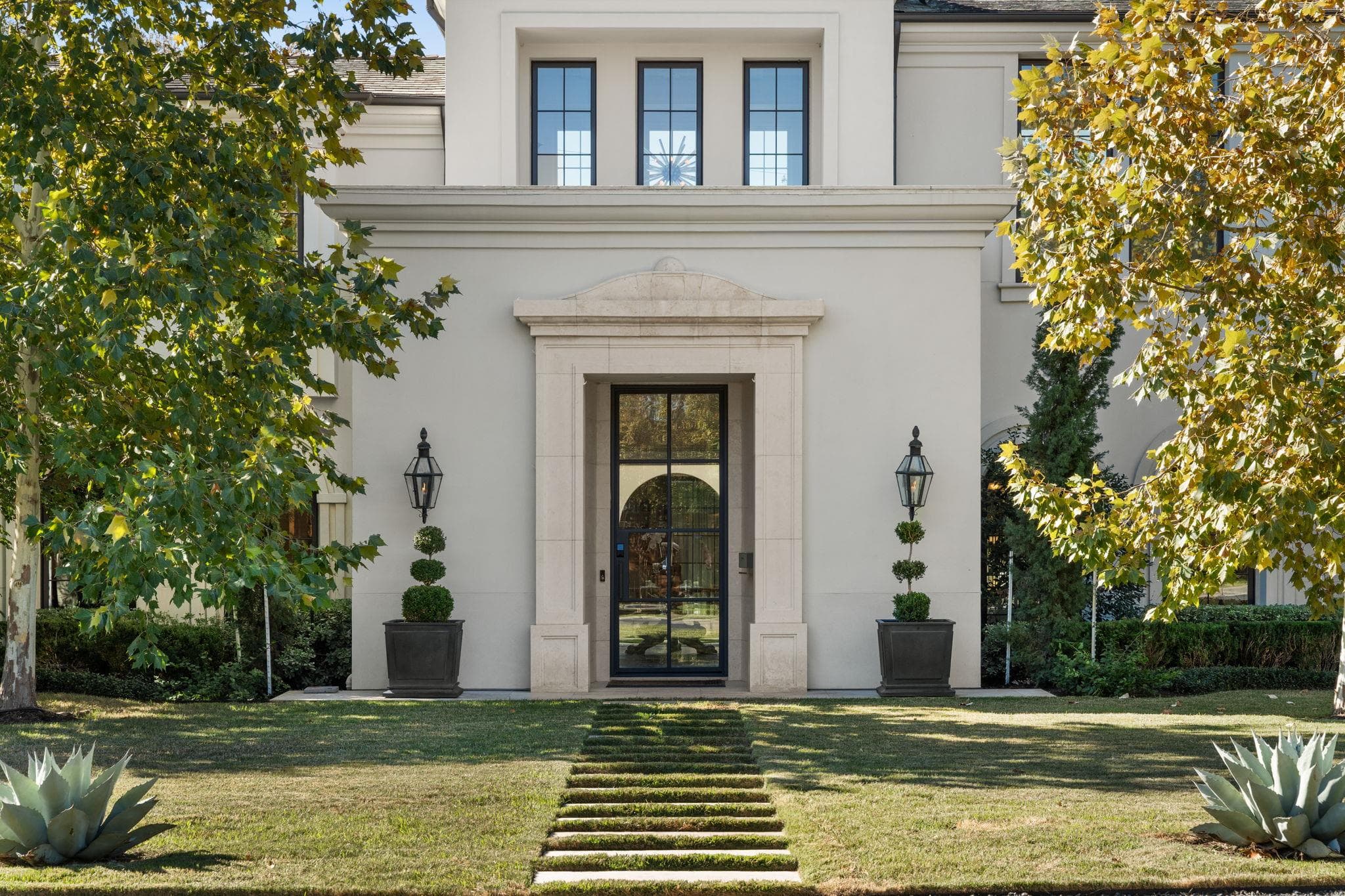 Symmetrical design highlights the stone-framed en