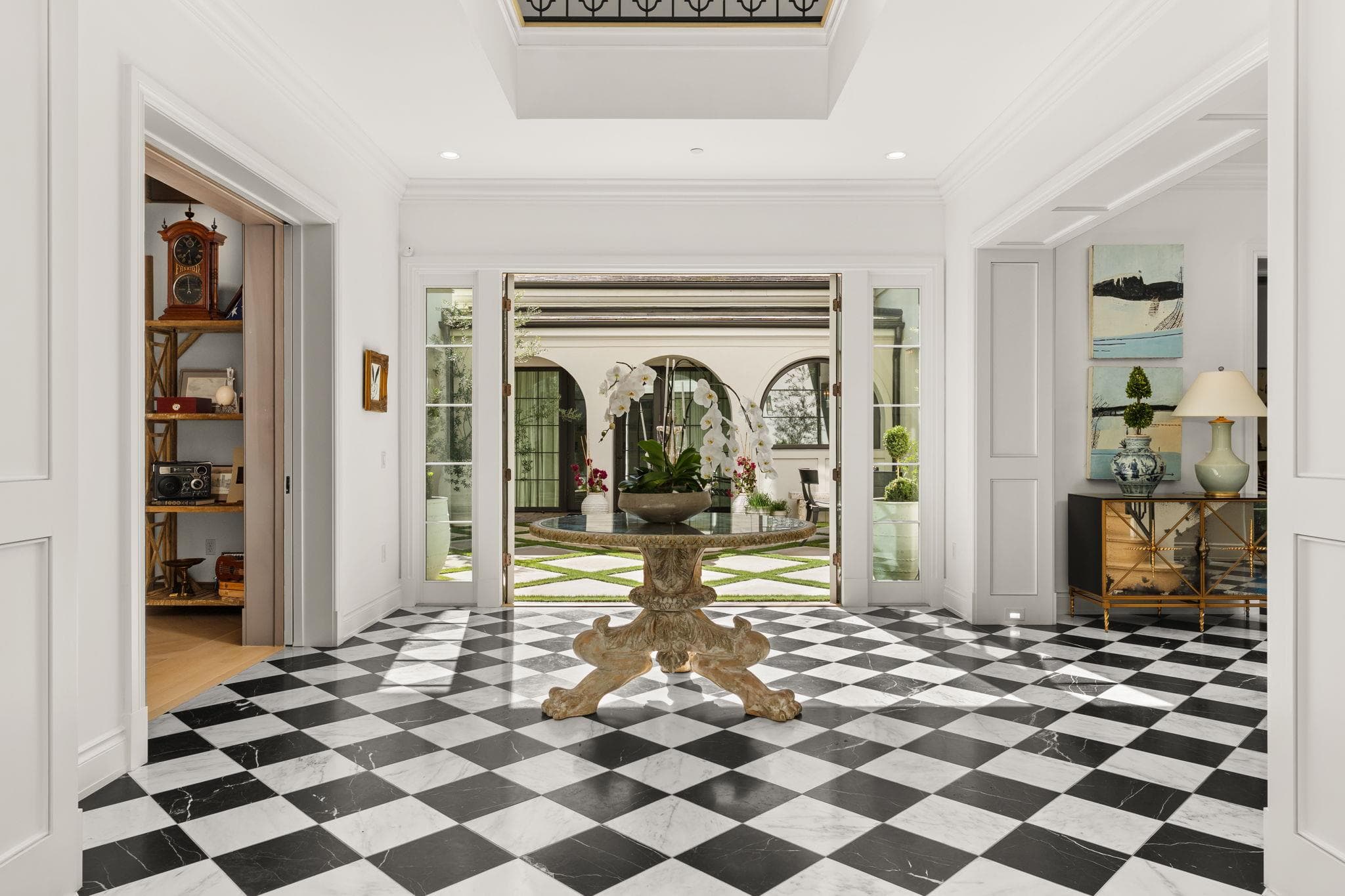 Bold checkerboard flooring anchors a grand entry
