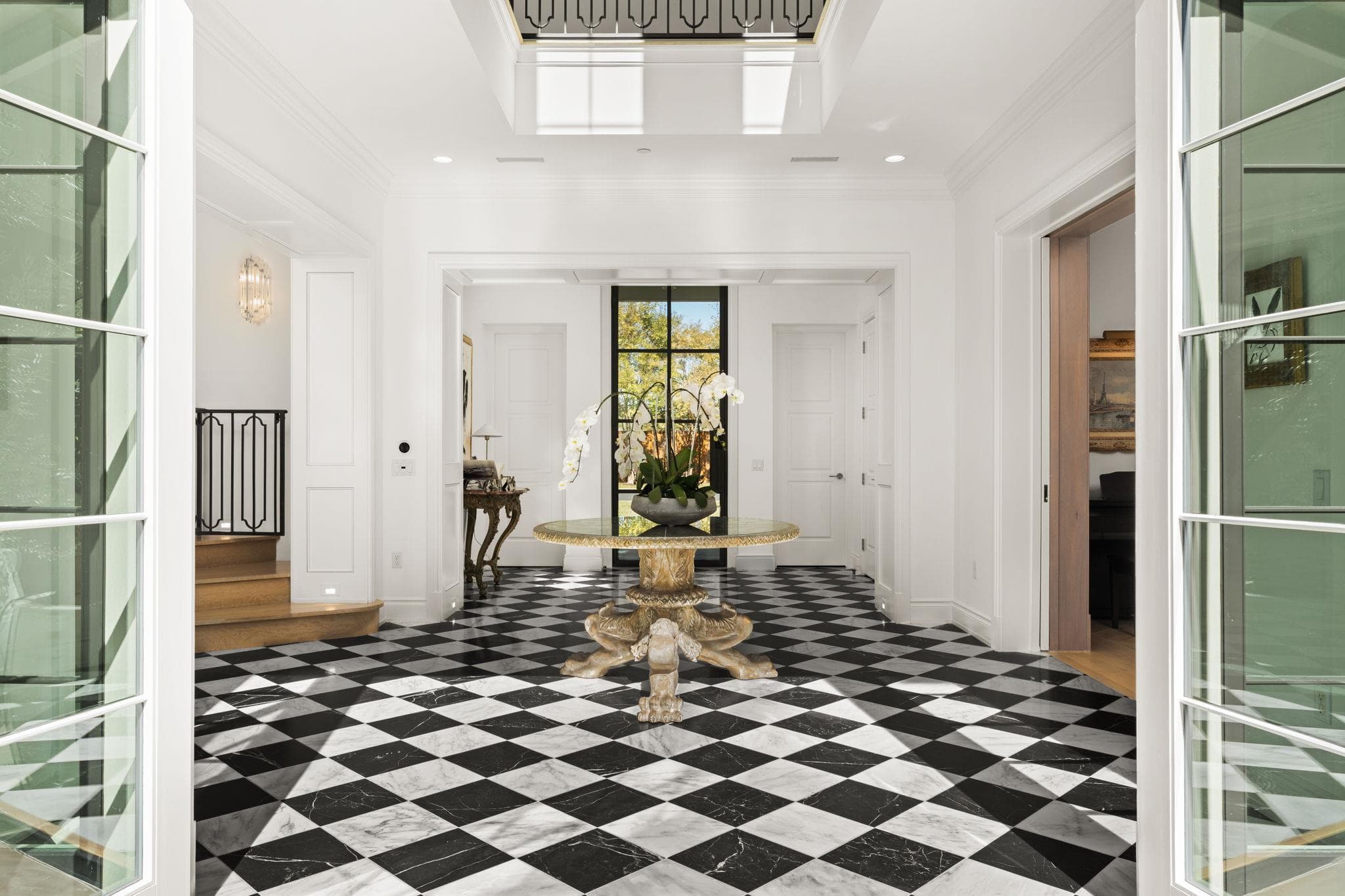 Striking checkered marble tile and high ceilings