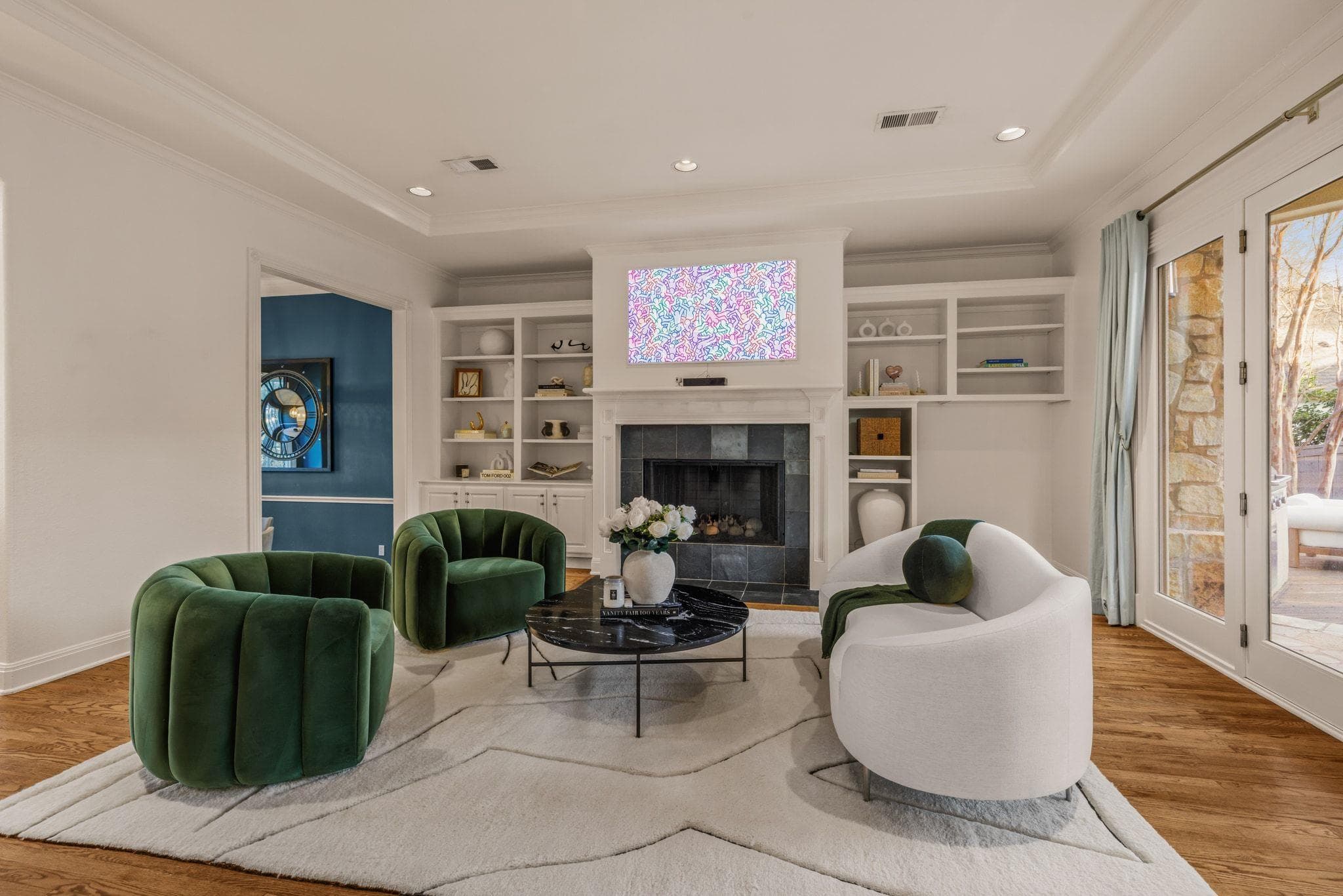 Sitting room featuring light wood-style floors, c
