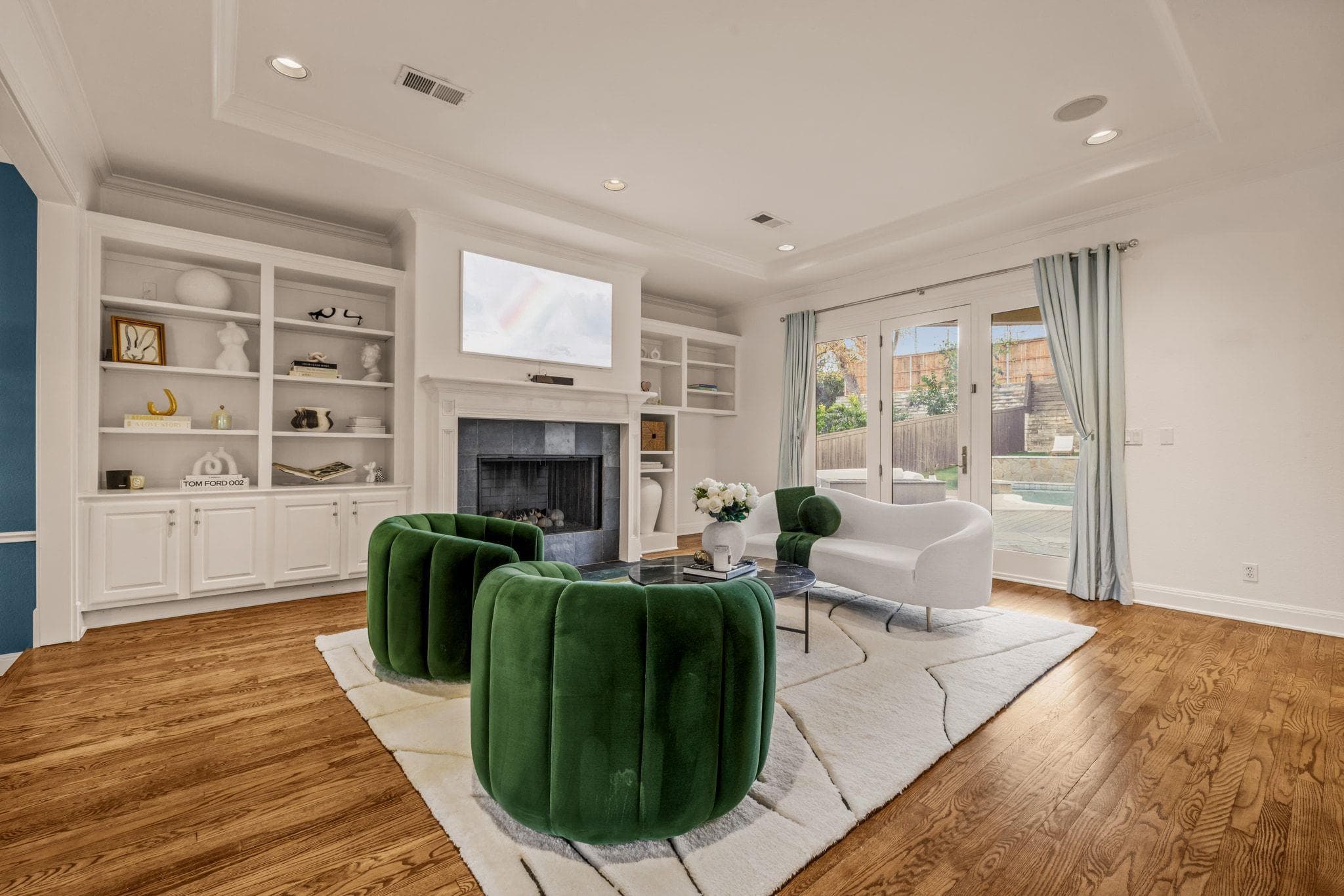 Living room featuring light wood-style floors, a