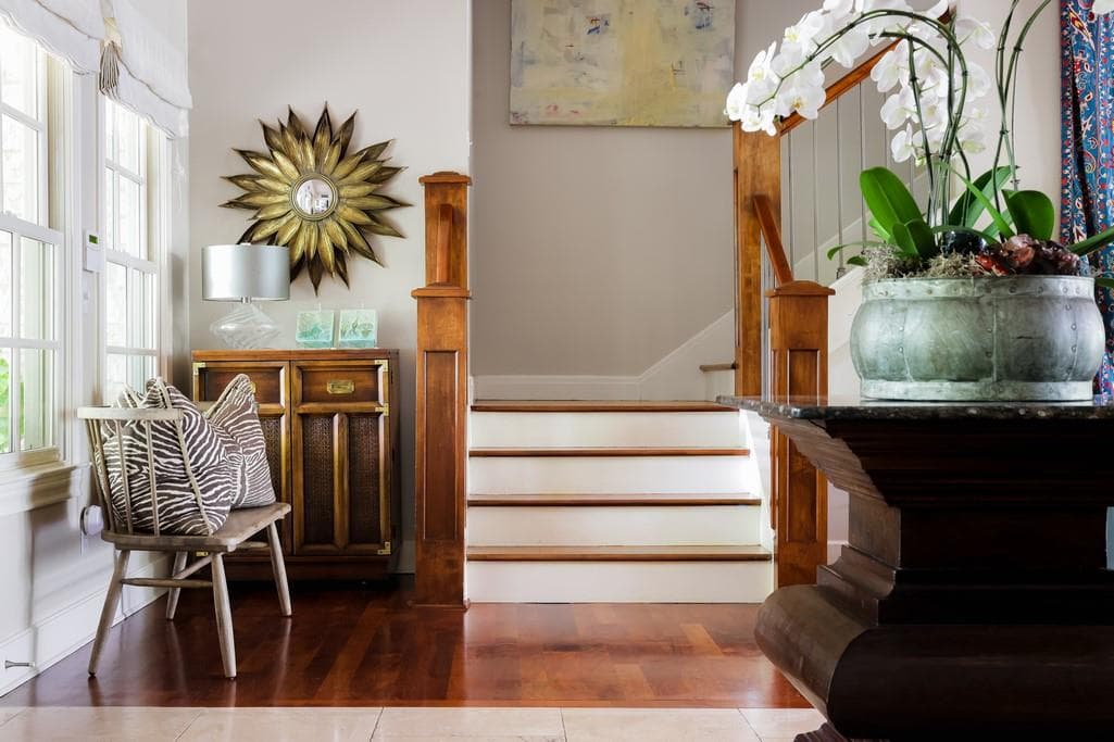 Entryway featuring rich wood-finish flooring, a b
