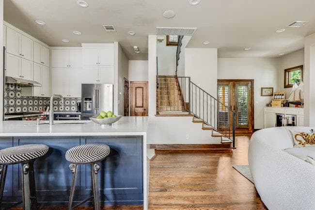 Kitchen with stainless steel fridge with ice disp