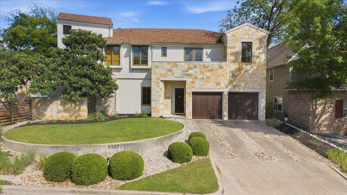 View of front of house featuring stone siding, dr