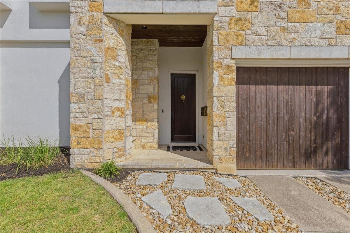 Property entrance with stone siding